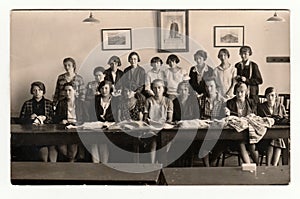 Vintage photo of a group girls in the classroom, 1933