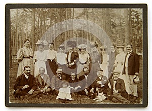 Vintage photo of the group of people in the forest