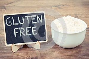 Vintage photo, Millet flour in glass bowl, healthy gluten free food and nutrition