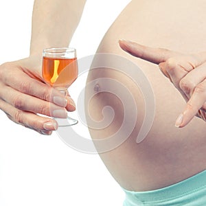 Vintage photo, Pregnant woman with glass of wine, concept of unhealthy lifestyles during pregnancy