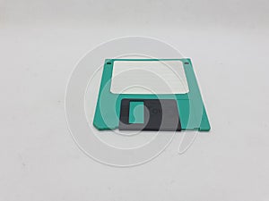 Vintage Photo Realistic Small Electronic Magnetic Floppy Disk for Old Computer Data Storage in White Isolated Background