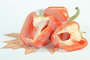 Vintage photo, Red peppers with autumnal leaf on white background, healthy nutrition and autumn concept