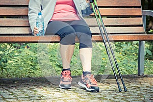 Vintage photo, Senior woman resting after nordic walking, sporty lifestyles in old age concept