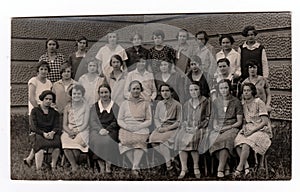 Vintage photo shows a group of girls (classmates) in front of school on June 27, 1927 in Hodonin