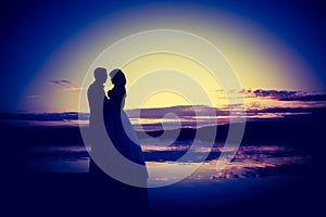 Vintage photo of wedding couple silhouettes in outdoor