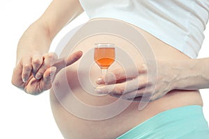 Vintage photo, Woman in pregnant with glass of wine, concept of unhealthy lifestyles during pregnancy