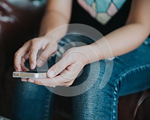 Vintage photo of woman using mobile smart phone in coffee shop.