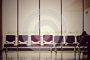 Vintage picture of empty chairs in the terminal of airport