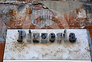 Vintage pizzeria sign in Italy