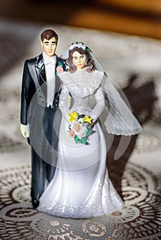 Vintage plastic wedding cake topper of bride and groom