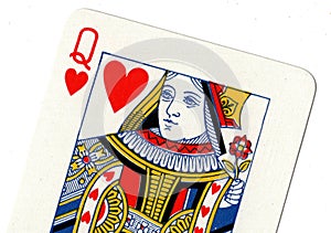 Vintage playing card showing a close up of the queen of hearts.