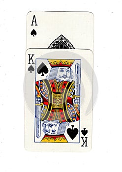 Vintage playing cards showing an ace and king of spades.