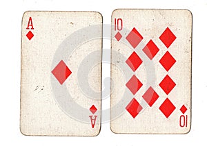 Vintage playing cards showing an ace and ten of diamonds.