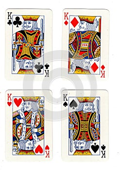 Vintage playing cards showing four kings.