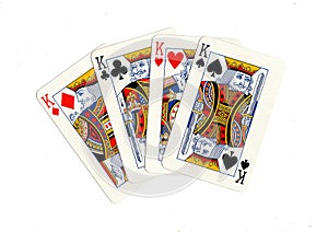 Vintage playing cards showing four kings.