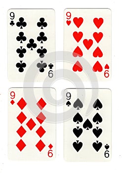Vintage playing cards showing four nines. photo