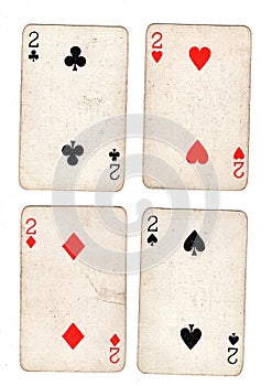 Vintage playing cards showing four twos.