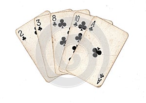 Vintage playing cards showing a hand of clubs.