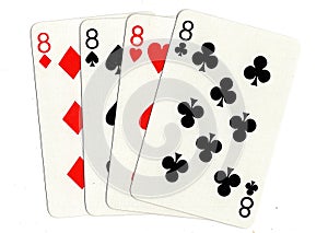 Vintage playing cards showing a hand of four eights.