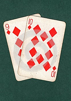 Vintage playing cards showing a nine and ten of diamonds.