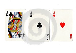 Vintage playing cards showing a pair of pair of aces and a queen.