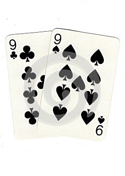 Vintage playing cards showing a pair of black nines. photo