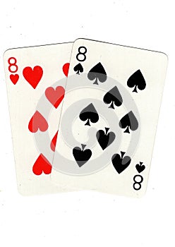 Vintage playing cards showing a pair of eights.