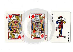 Vintage playing cards showing a pair of jacks and a joker.