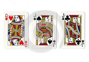 Vintage playing cards showing a pair of jacks and a queen.