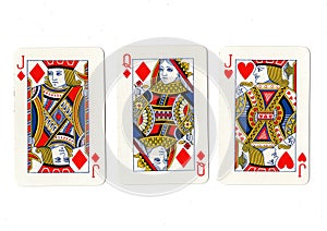 Vintage playing cards showing a pair of jacks and a queen.