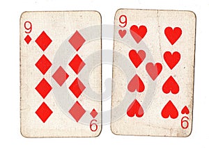 Vintage playing cards showing a pair of nines. photo