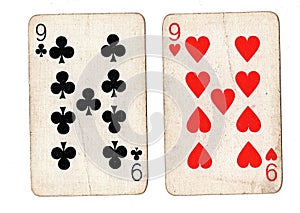 Vintage playing cards showing a pair of nines. photo