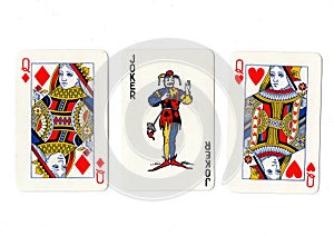 Vintage playing cards showing a pair of queens and a joker.