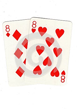 Vintage playing cards showing a pair of red eights.