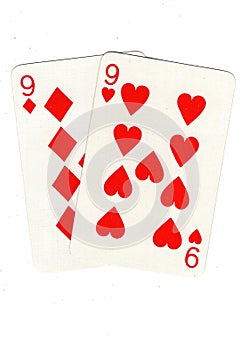 Vintage playing cards showing a pair of red nines. photo