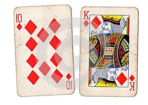 Vintage playing cards showing a ten and king of diamonds..