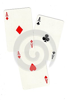Playing cards showing three aces.