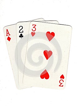Vintage playing cards showing a three card run in different suits.