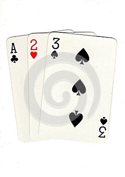 Vintage playing cards showing a three card run in different suits.