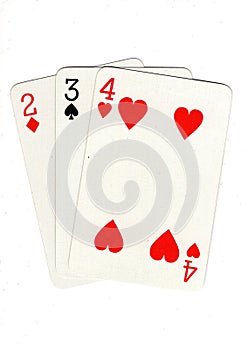 Vintage playing cards showing a three card run in different suits.