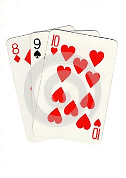 Vintage playing cards showing a three card run in different suits.