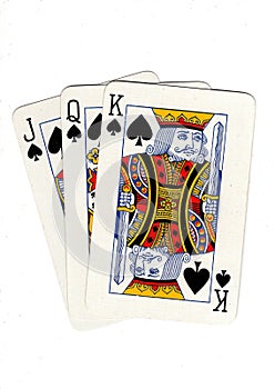 Vintage playing cards showing a three card run of soades.