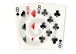 Vintage playing cards showing three eights.