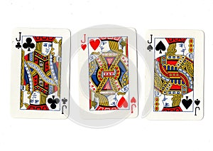 Vintage playing cards showing three jacks.