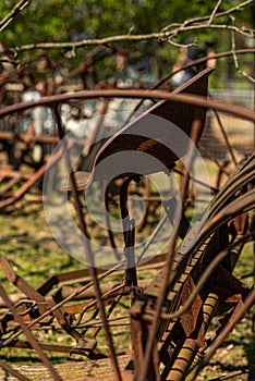 vintage plowing machine. old farm machinery. Old rusty plow. Nobody, selective focus