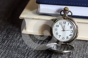 Vintage pocket watch with books