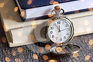 Vintage pocket watch with books