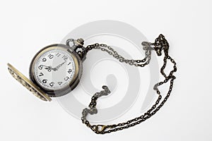Vintage pocket watch on a chain on a white background