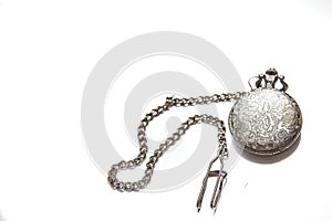 Vintage pocket watch with a chain on white isolated background