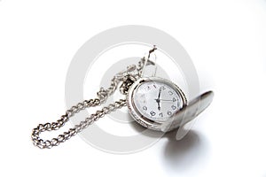 Vintage pocket watch with a chain on white isolated background